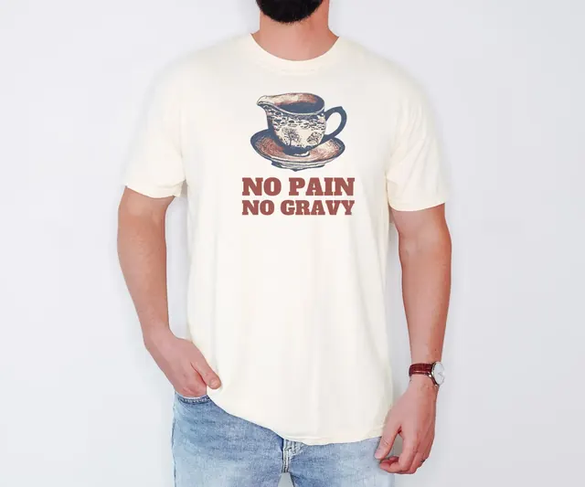 Person wearing a Ivory tee printed with NO PAIN NO GRAVY