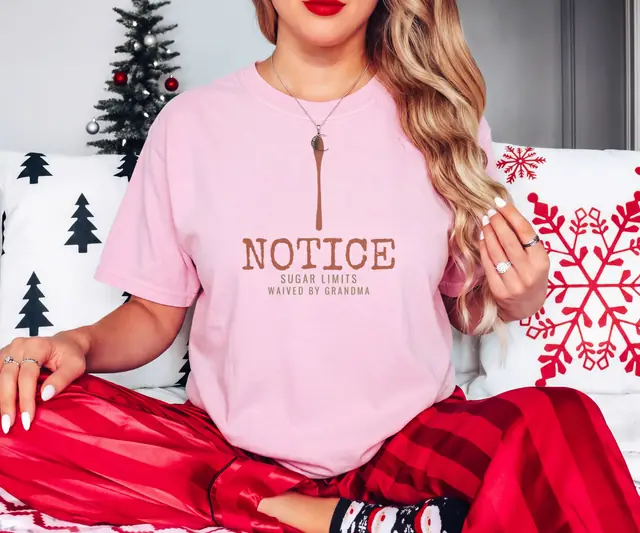 Person wearing a Blossom tee printed with NOTICE, SUGAR LIMITS WAIVED BY GRANDMA