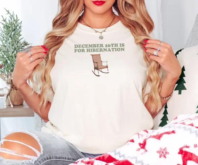 Person wearing a Ivory tee printed with DECEMBER 26TH IS FOR HIBERNATION